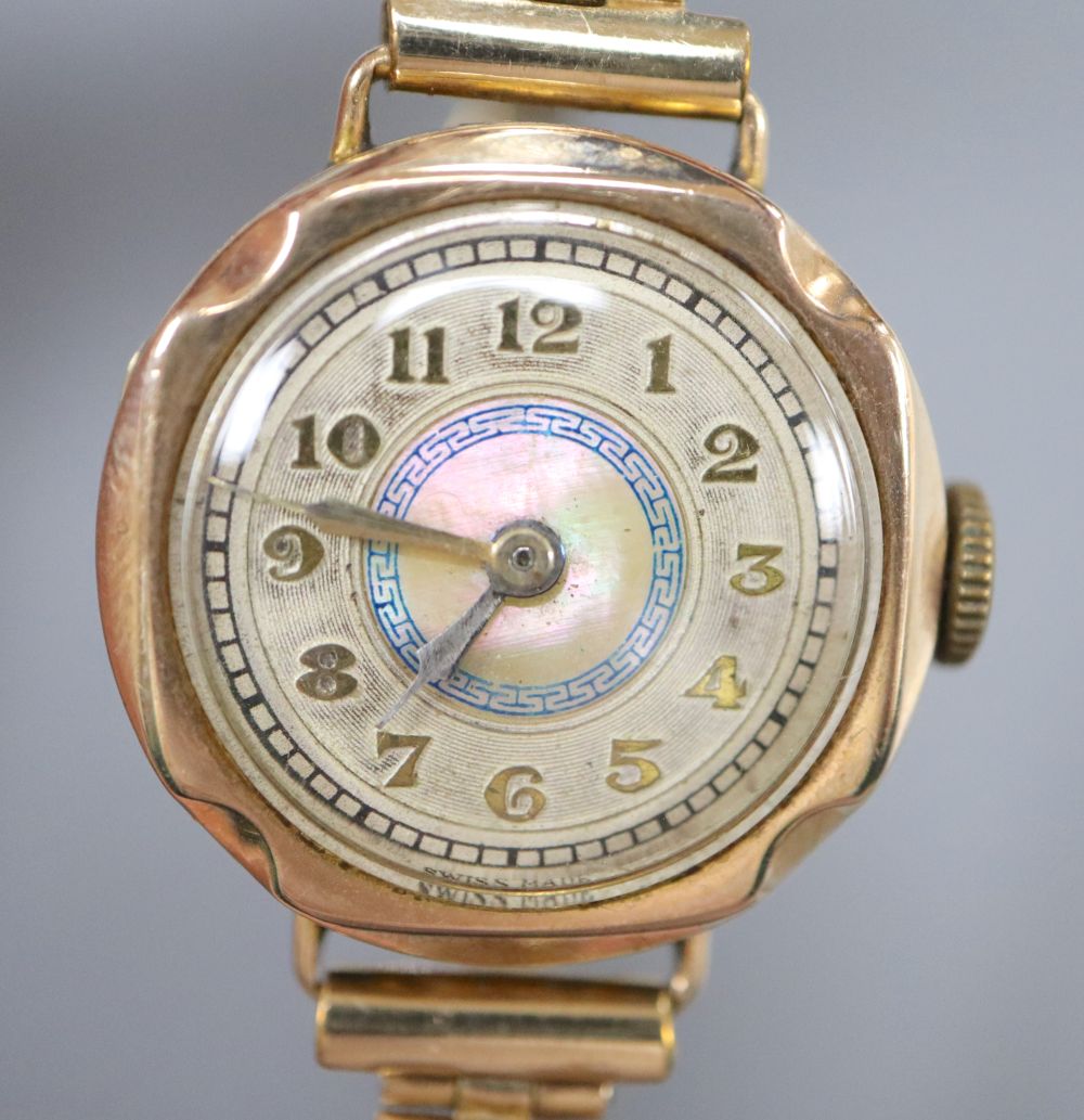 A ladys 9ct gold cased wristwatch, with gilt metal expanding strap, case diameter 24mm ex. crown, gross 21.2 grams.